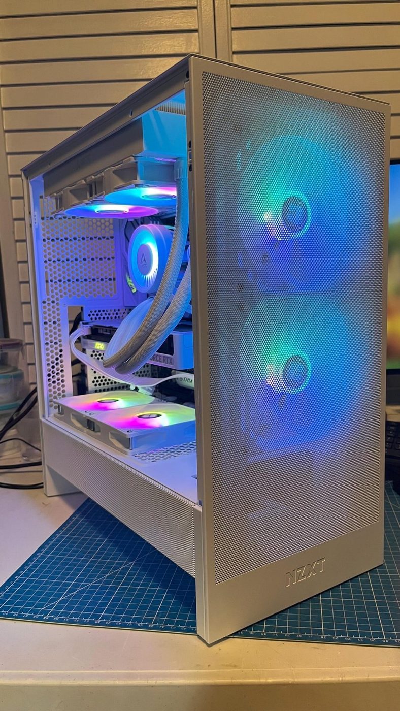 White NZXT H5 Flow gaming PC with a GeForce RTX 5060 card