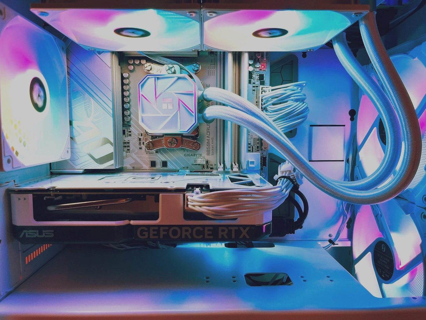 White gaming PC with an ASUS GeForce RTX card and a Gigabyte B850M Aorus board