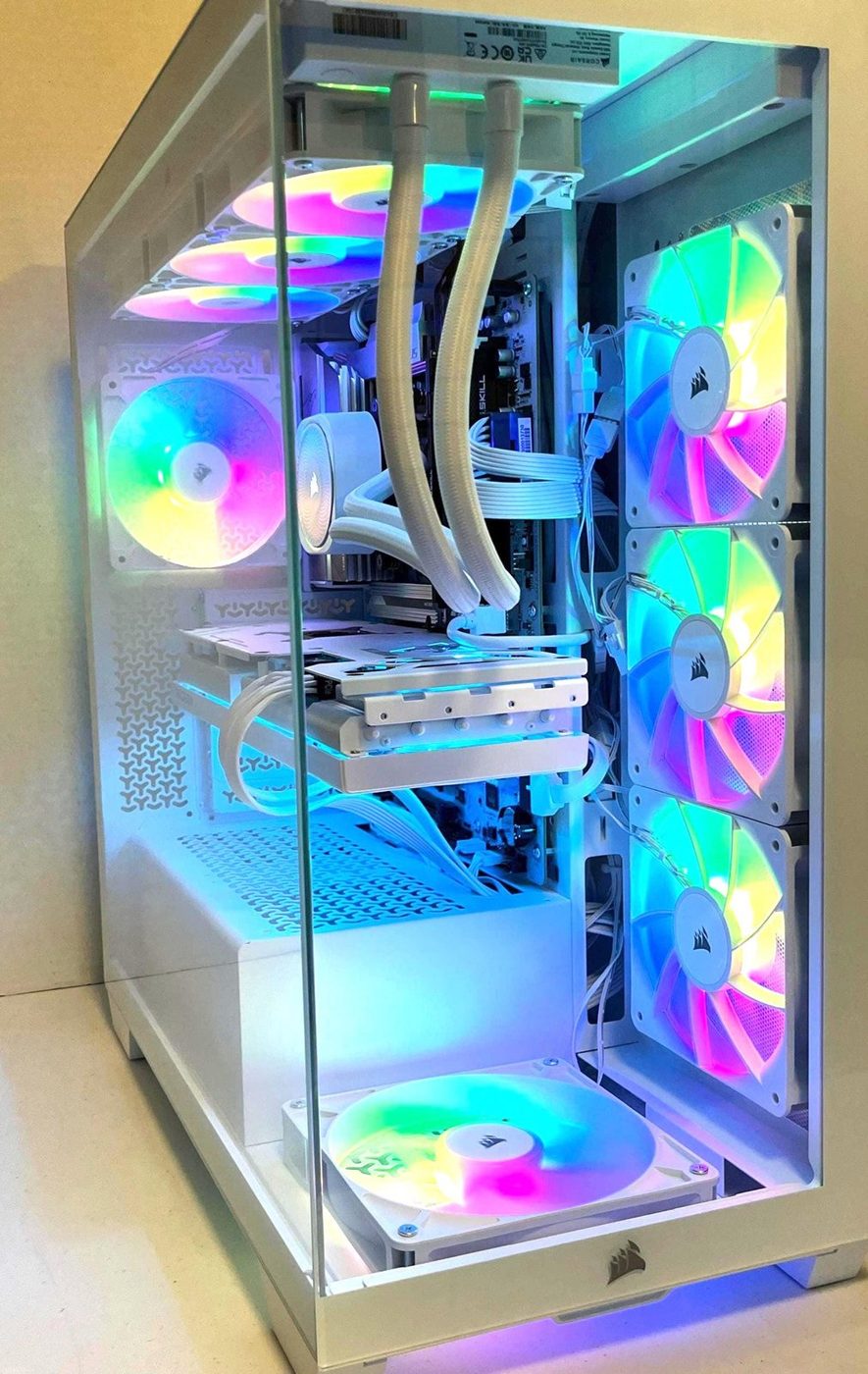 White Corsair gaming PC with RGB fans and a white liquid cooler
