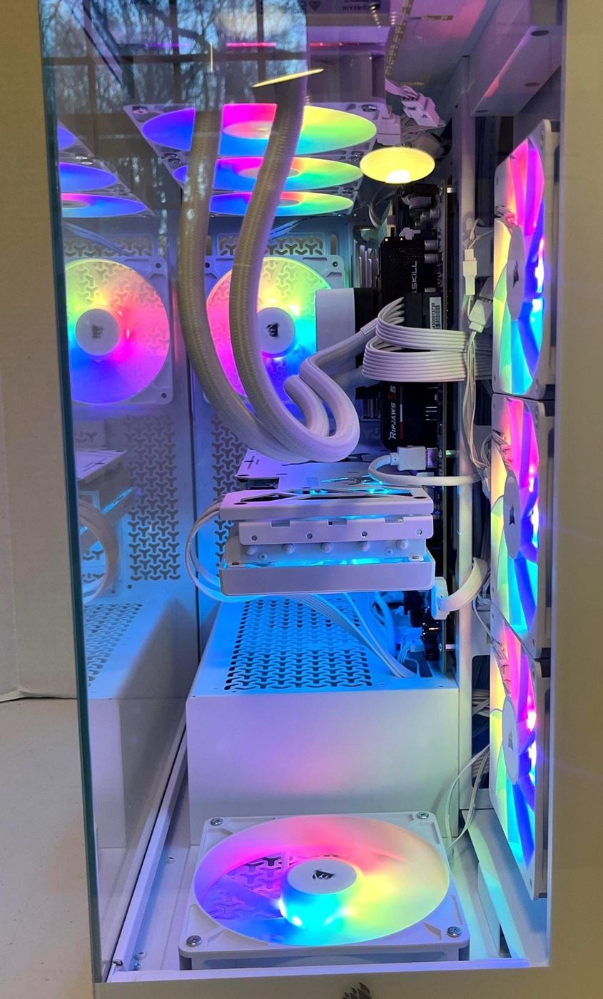 Inside a white Corsair gaming PC: white cabling, G.Skill Ripjaws memory and RGB fans, built by NG+ GameBuilds